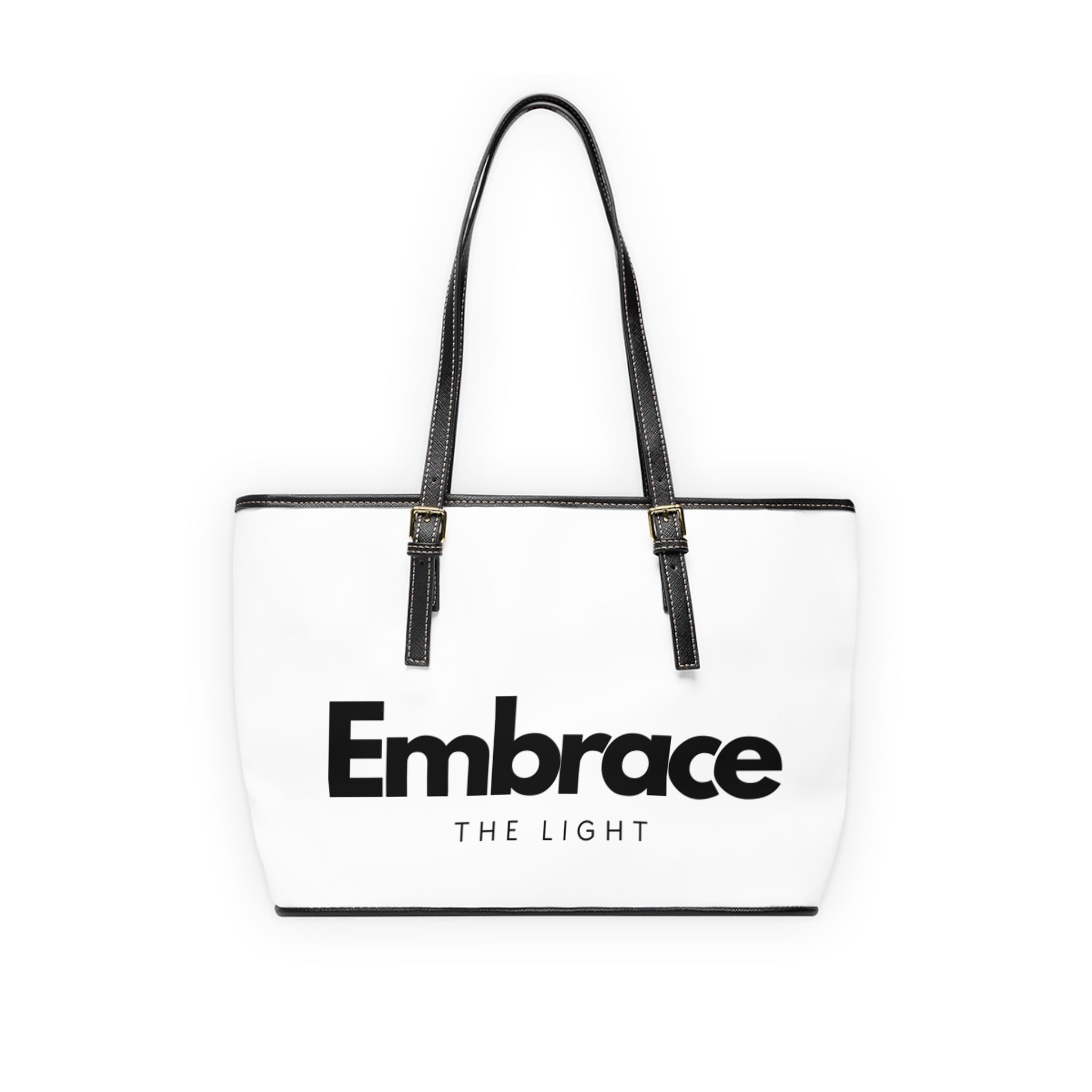 Stylish PU leather shoulder bag with 'Embrace the Light' text design. Spacious, durable, and features black handles with gold-tone accents.