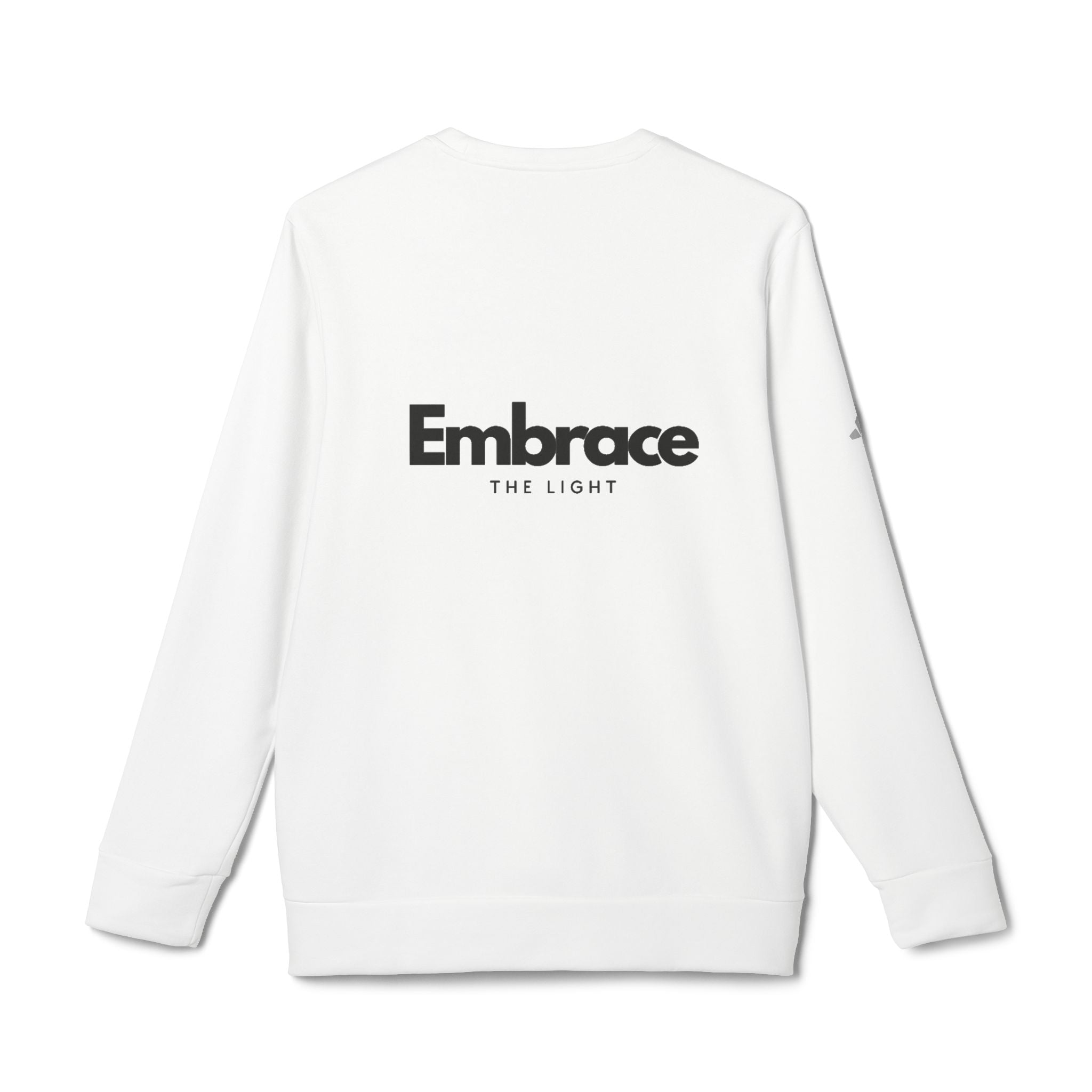 Adidas fleece sweatshirt in white with 'Embrace The Light' text on the back. Eco-friendly crewneck made with BCI cotton and recycled polyester for warmth and sustainability.