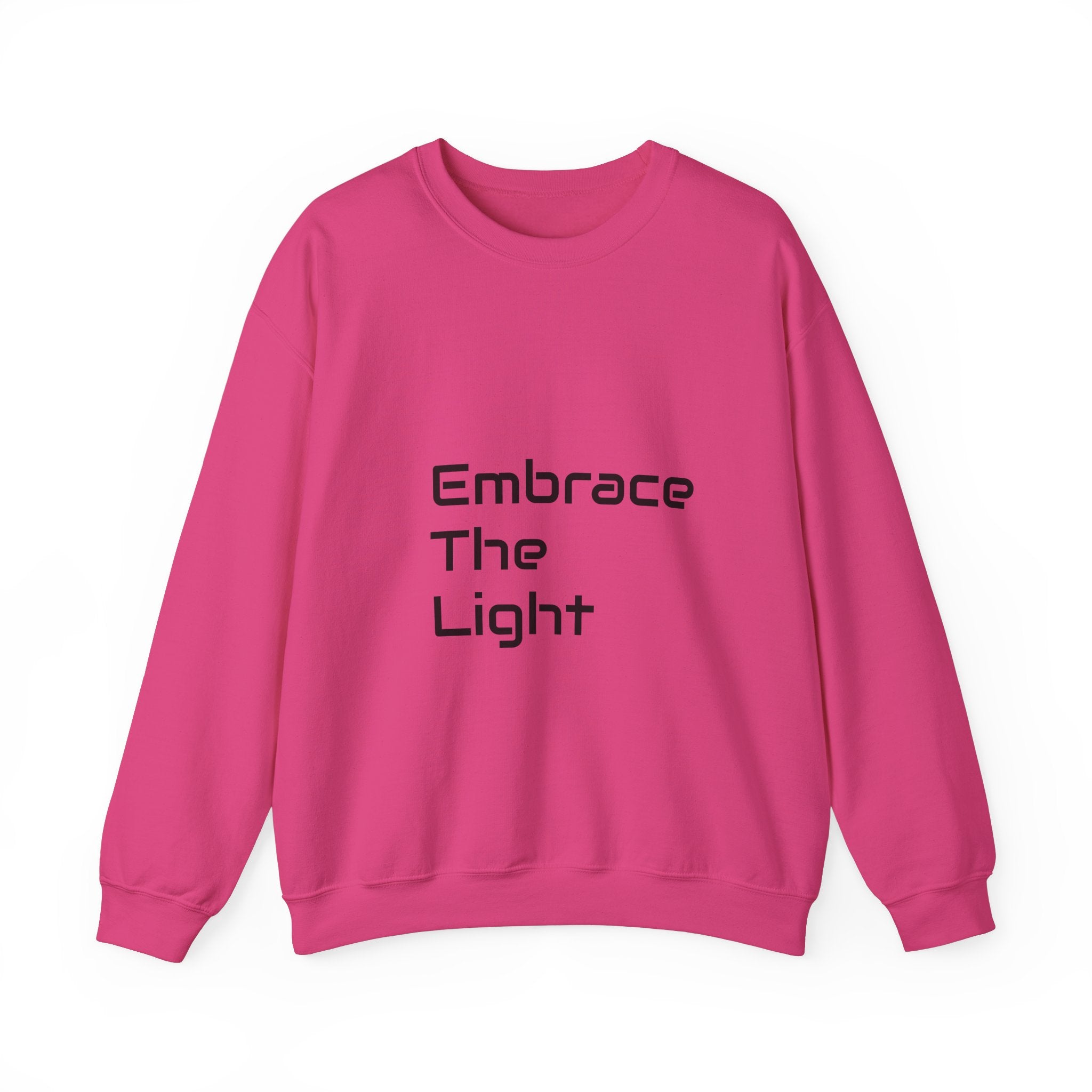 Unisex crewneck sweatshirt in vibrant pink with 'Embrace The Light' text print. Made from a soft cotton-polyester blend for comfort and durability.