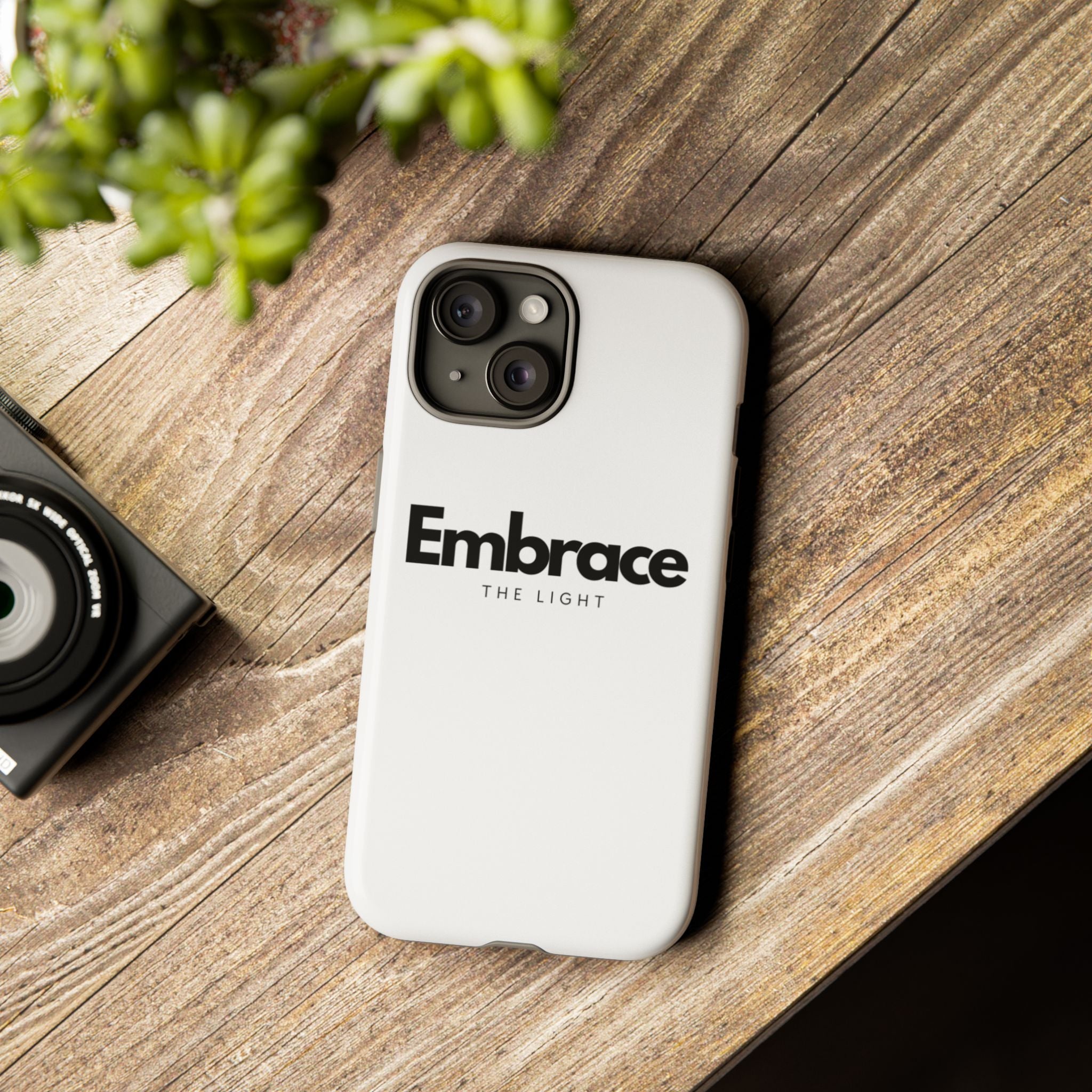 Tough Cases - Custom Protective Phone Case with 'Embrace the Light' text design. Durable dual-layer cover for iPhone, available in matte or glossy finish.