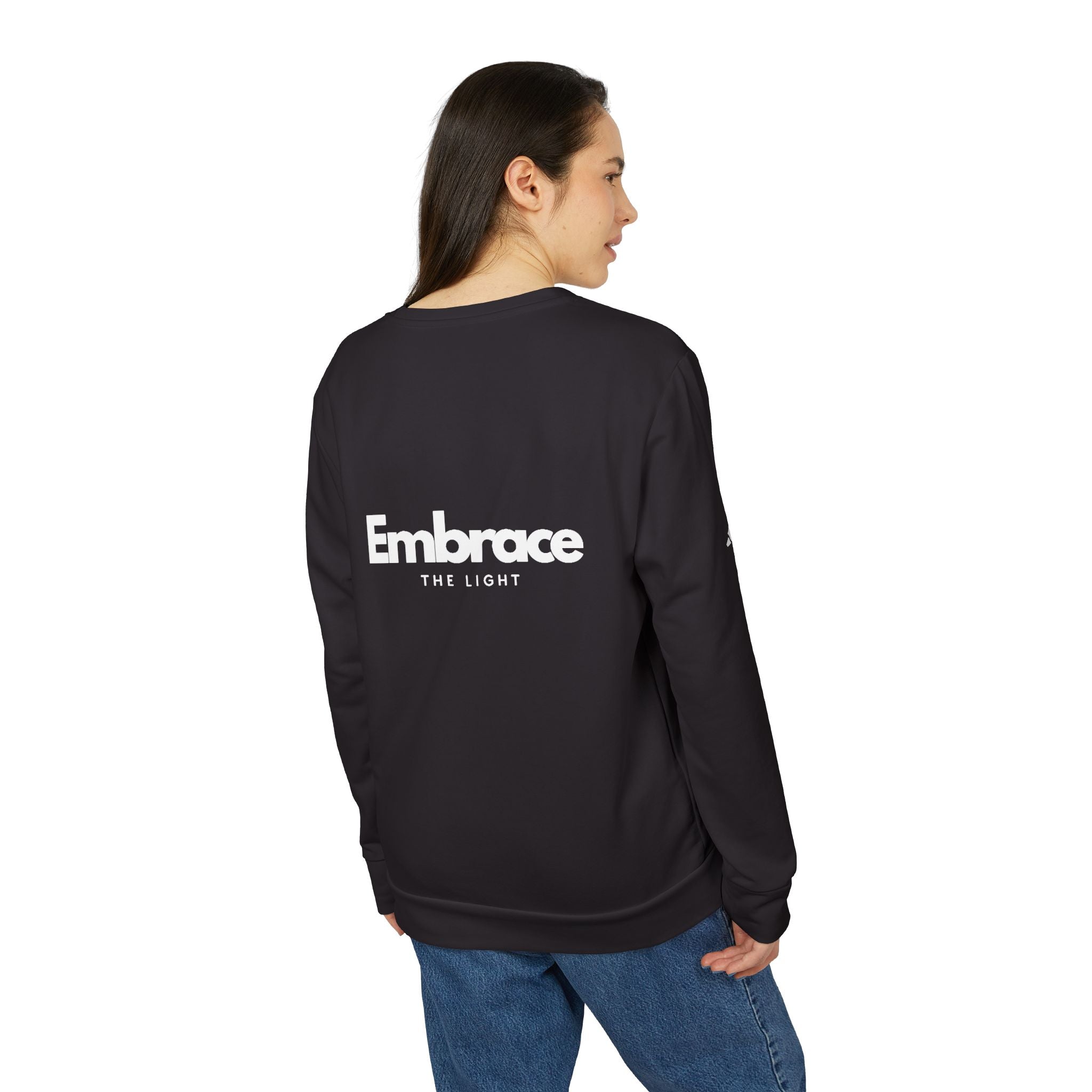 Adidas fleece crewneck sweatshirt in black with 'Embrace The Light' text on the back. Eco-friendly, warm, and sustainable unisex sportswear.