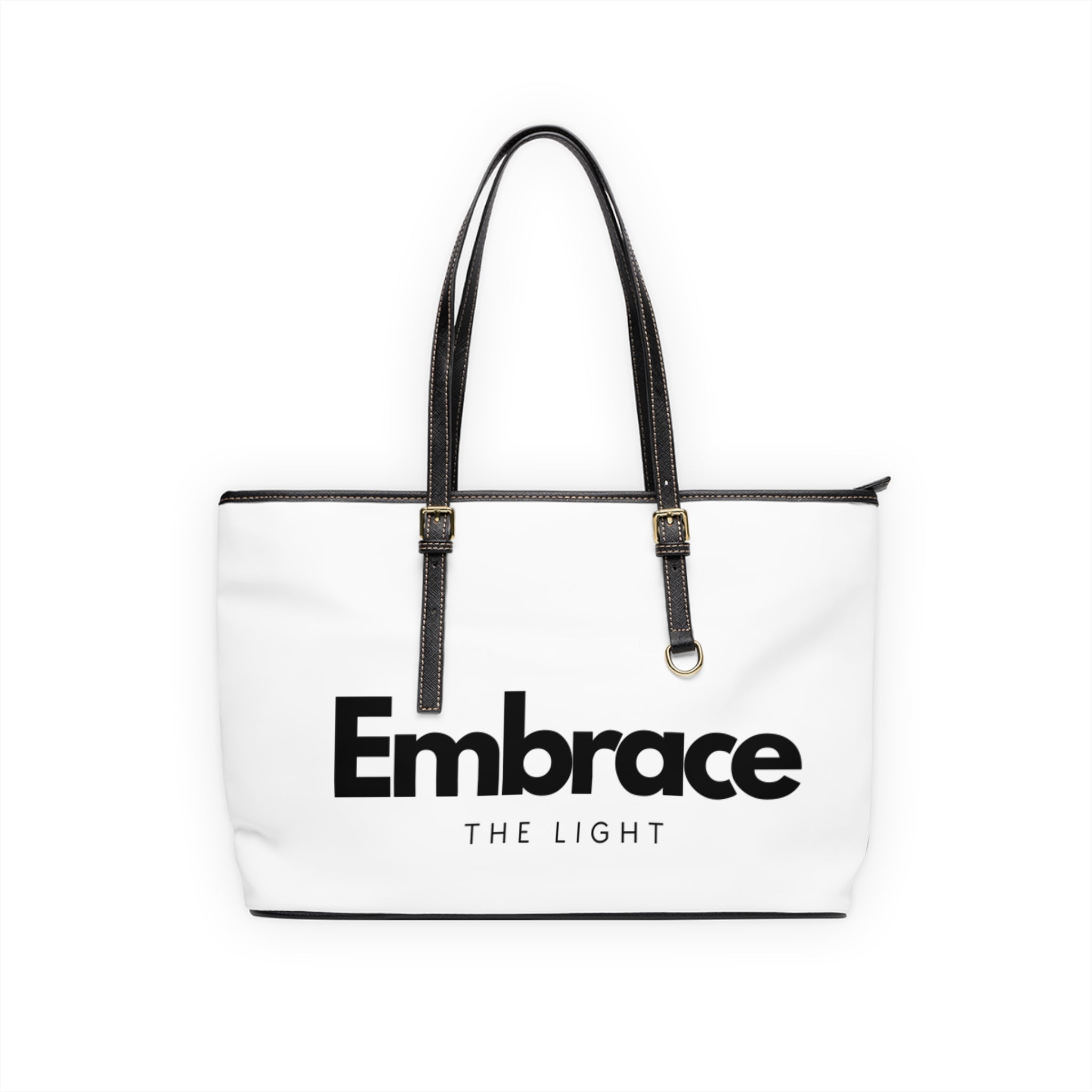 Stylish PU leather shoulder bag with 'Embrace The Light' text design. Spacious and durable with black handles and gold-tone accents.