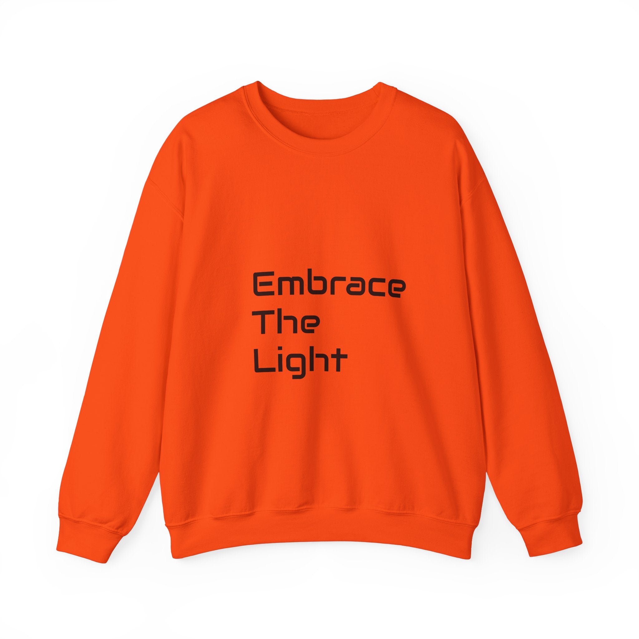 Unisex crewneck sweatshirt in vibrant orange with 'Embrace The Light' text print. Made from a soft 50/50 cotton blend for comfort and durability.