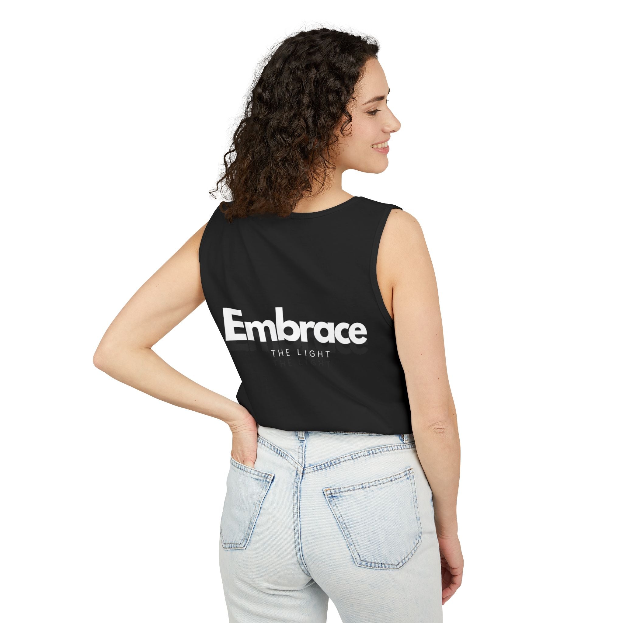 Unisex tank top in black with 'Embrace The Light' text on the back. Made from sustainable US cotton with a relaxed fit for comfort and style.