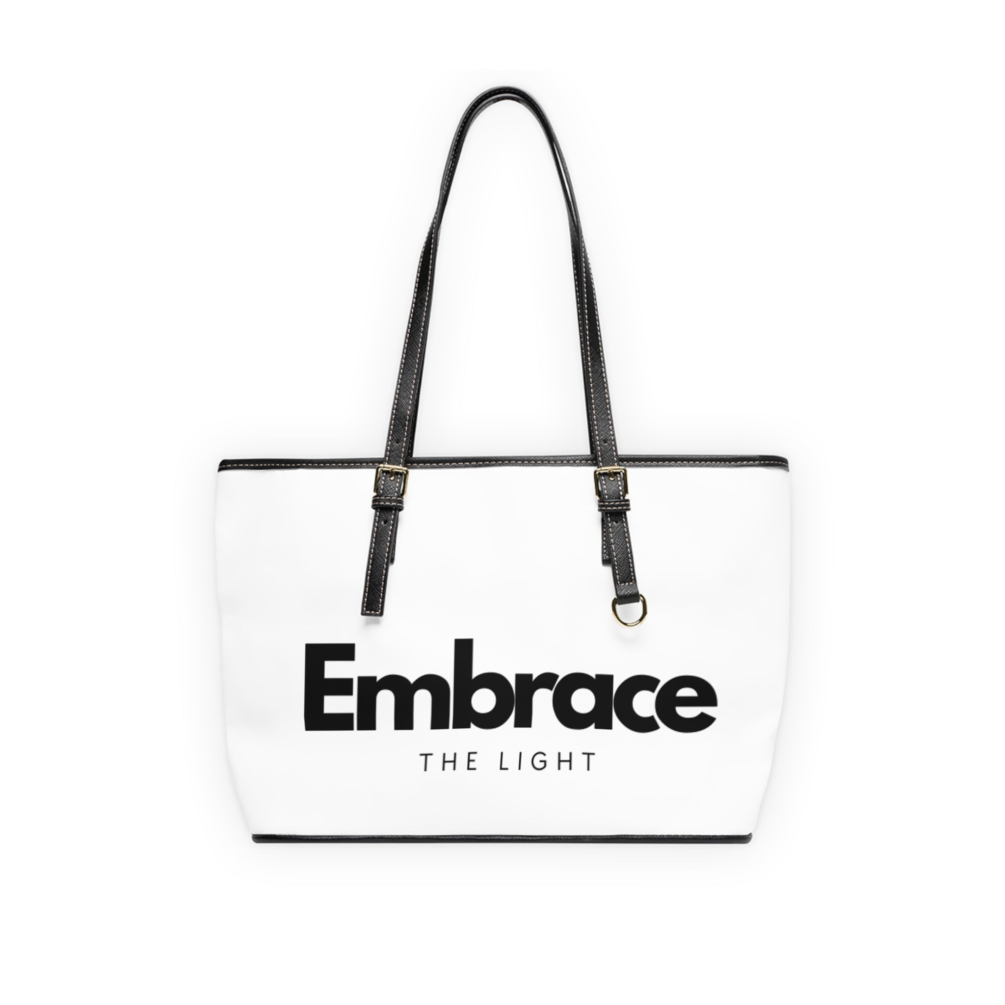 Stylish PU leather shoulder bag with 'Embrace The Light' text design. Spacious, durable, and features black handles with gold-tone accents.